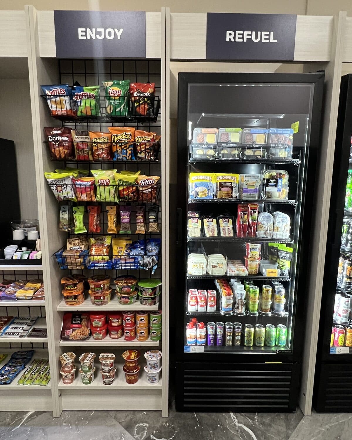 Micro market with snack shelving and a stocked cooler