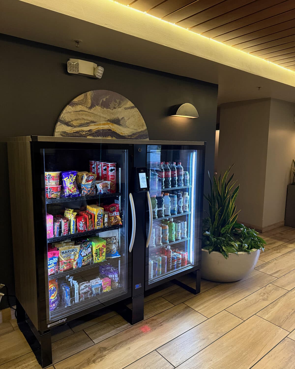 Two smart coolers installed in a building lobby